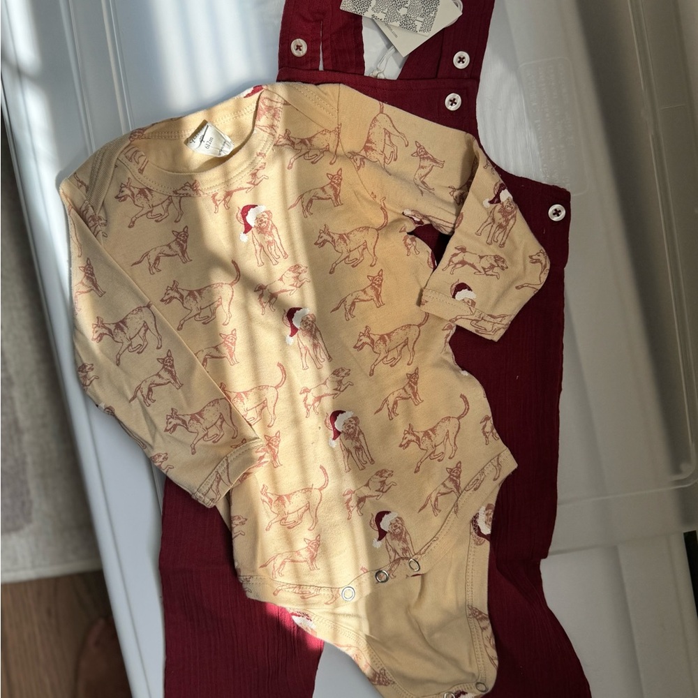Kate Quinn Holiday Kids One-Piece Long Sleeve Bodysuit in Tan with Red Dog Print